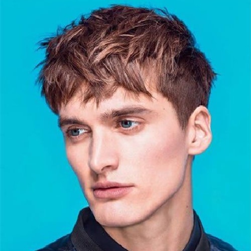 model with short sides and longer hair on top