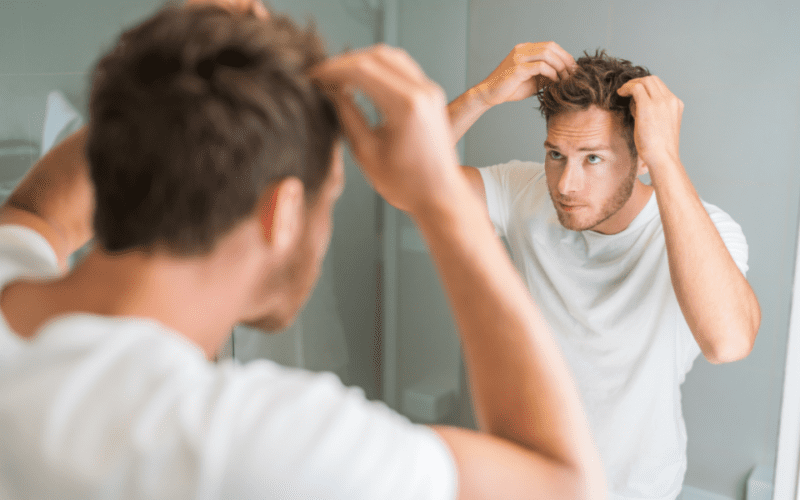 styling hair in mirror