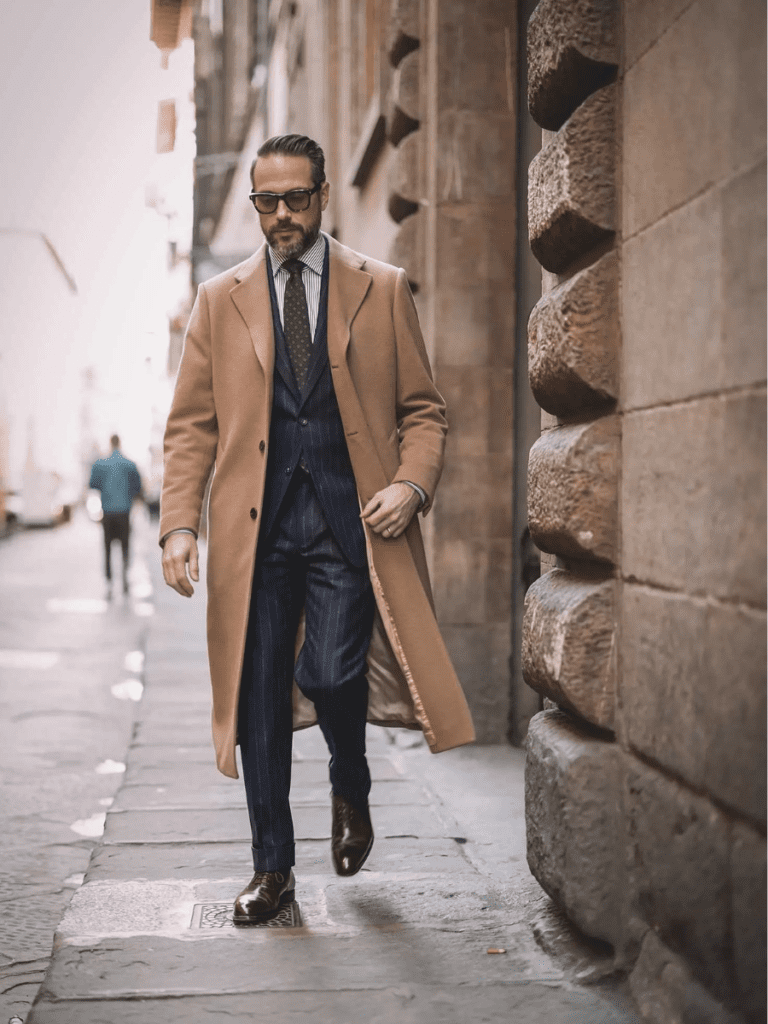 camel coat worn formal with suit
